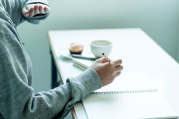 Fototapeta premium Writing on paper at work on the table in the morning, business ideas. There is space for copying.