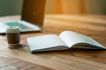 A desk with a business computer and a note on the desk. Business concept with copy space.