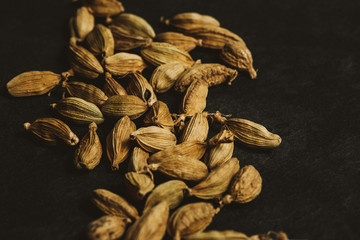 Cardamom pods in a moody light