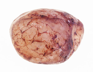 pebble of pink quartz stone on white