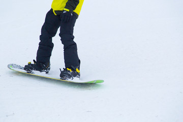 a snowboarder rides a snowboard