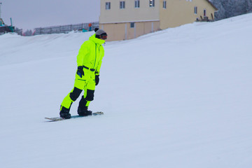 a snowboarder rides a snowboard