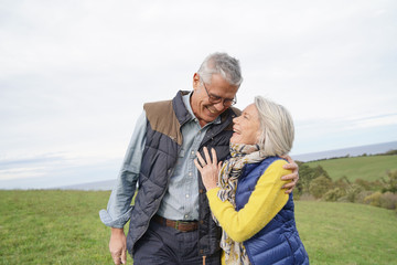  Healthy senior couple on countryside walk