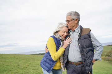  Healthy senior couple on countryside walk