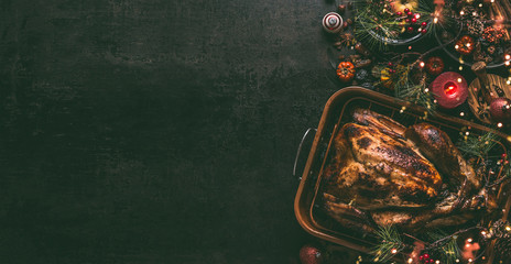 Whole roasted turkey, stuffed with dried fruits in roasting pan for Christmas dinner, served on...