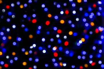 Texture with New Year's glare of mauve, blue, red, orange and white colors.