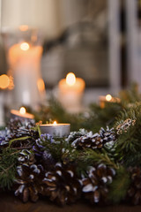 Christmas, Advent Decorative Wreath Candle Decoration. In a burning candle in a beautiful decorative wreath.