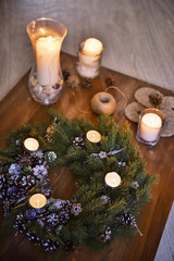 Christmas, Advent Decorative Wreath Candle Decoration. In a burning candle in a beautiful decorative wreath.