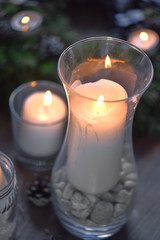 Christmas, Advent Decorative Wreath Candle Decoration. In a burning candle in a beautiful decorative wreath.