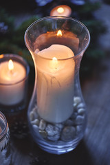 Christmas, Advent Decorative Wreath Candle Decoration. In a burning candle in a beautiful decorative wreath.