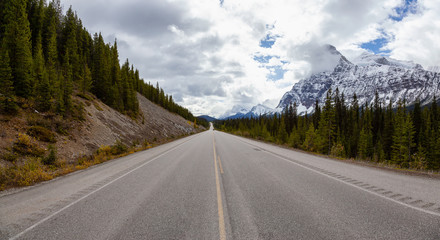 Beautiful panoramic view of a scenic road in the Canadian Rockies during Fall Season. Taken in Icefields Pkwy, Banff, Alberta, Canada.