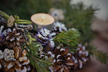 Christmas, Advent Decorative Wreath Candle Decoration. In a burning candle in a beautiful decorative wreath.