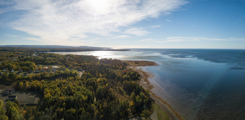 Aerial panoramic view of the Atlantic Ocean Coast during a sunny morning. Taken near Gesgapegiag, Quebec, Canada.