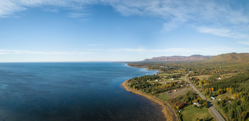 Aerial panoramic view of the Atlantic Ocean Coast during a sunny morning. Taken near Gesgapegiag, Quebec, Canada.