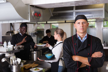 Confident male chef in restaurant kitchen