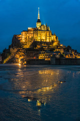 Mont Saint-Michel's lights reflecting in the tide zone