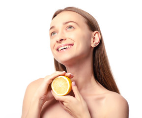 Beautiful woman with lemon beauty fashion skin freshness face on a white background. Isolation