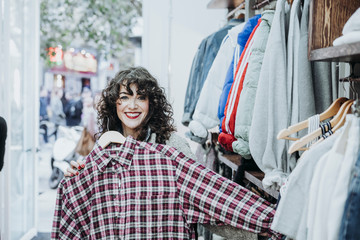 Woman buying clothes at the fashion store