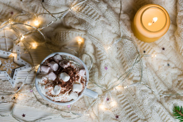Winter hot drink, cacao with marshmallows and christmas decorations, spicy hot chocolate