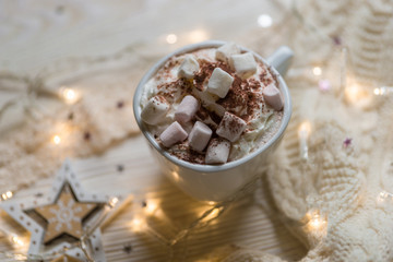 Winter hot drink, cacao with marshmallows and christmas decorations, spicy hot chocolate