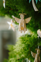 Christmas angel on Christmas tree branch. New Year and Christmas