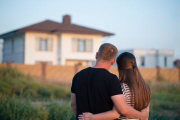 Couple looking at they's house
