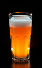 unfiltered beer on a dark background