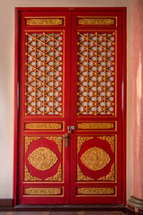 Chinese traditional red and gold door pattern style.