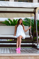 young girl in the garden near swimming pool 