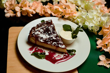 Cold cheesecake with cherry jelly.