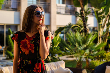 young woman in a beach cafe near swimming pool