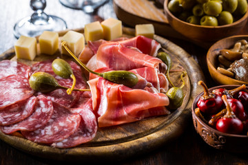 Serrano ham platter with variation of appetizers