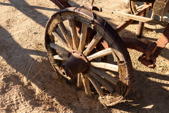 Antique old wagon wheel in the desert