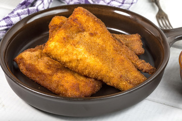Pieces of cod in breadcrumbs.