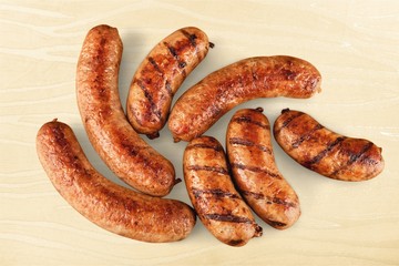 Roasted sausages on white background