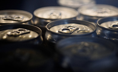 Light refreshments. Aluminum beverage cans. Drink cans. Pull tabs on cans tops. Metal containers designed for packaging of drinks and food. Carbonated soft drinks. Alcoholic or energy drinks