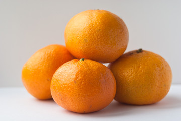 4 mandarin on white background