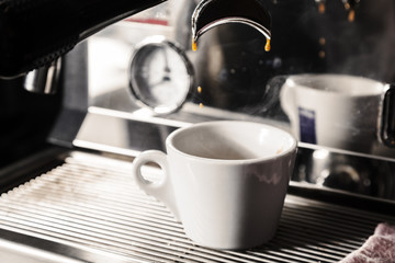 Professional espresso machine for brewing coffee. Coffee is poured into the Cup. The Concept Of Making Coffee In Barista Cafe