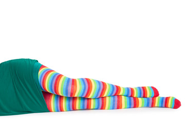 Perfect long female legs in rainbow stockings