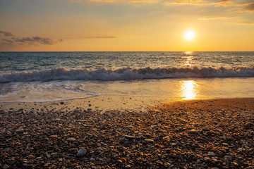 Beautiful sunset view of breaking waves at Petra tou Romiou (Aphrodite's birthplace) beach, in Paphos, Cyprus.