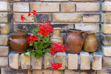clay pots on a brick wall