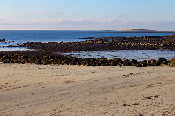 Fototapeta na wymiar Rocks and sand at Salt hill beach