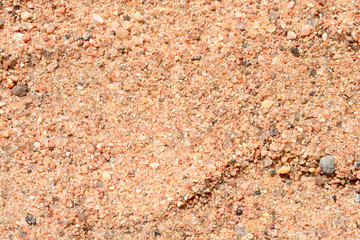 Sea sand background and texture. Fine sand on summer sun close up.