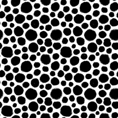 Black and white polka dot seamless pattern. Hand drawn vector ornament for wrapping paper.