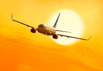 passenger plane fly over clouds