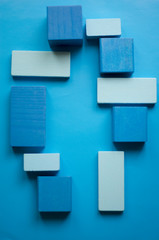 Fototapeta na wymiar Blue blocks light blue background 