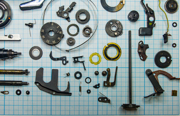 Fototapeta premium parts old retro film SLR camera on graph paper