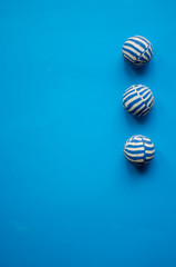 Fototapeta na wymiar Blue background balls with white stripes 