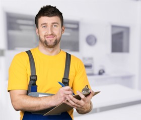 Portrait of cheerful Handsome  mechanic  on background