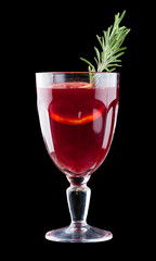 Mulled wine from berry. Warming drink on a dark background.